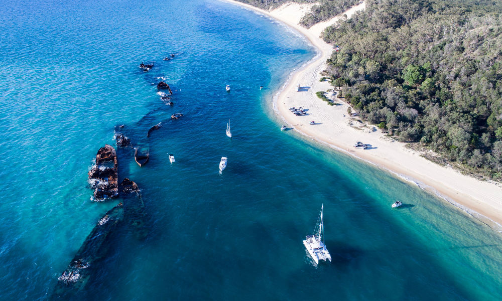 aerial image of Moreton Bay, with a beach and some sunken ships just off shore